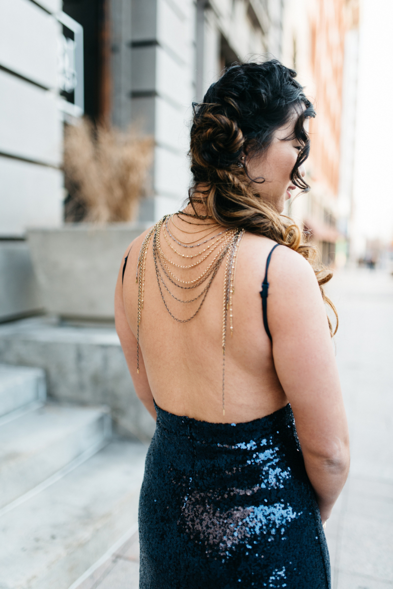 woman in a silver dress dancing on a light background party disco hairstyle  model earrings Stock Photo - Alamy