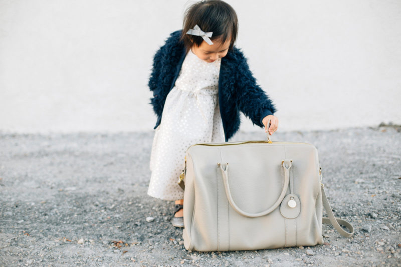 Baby girl with PacaPod diaper bag