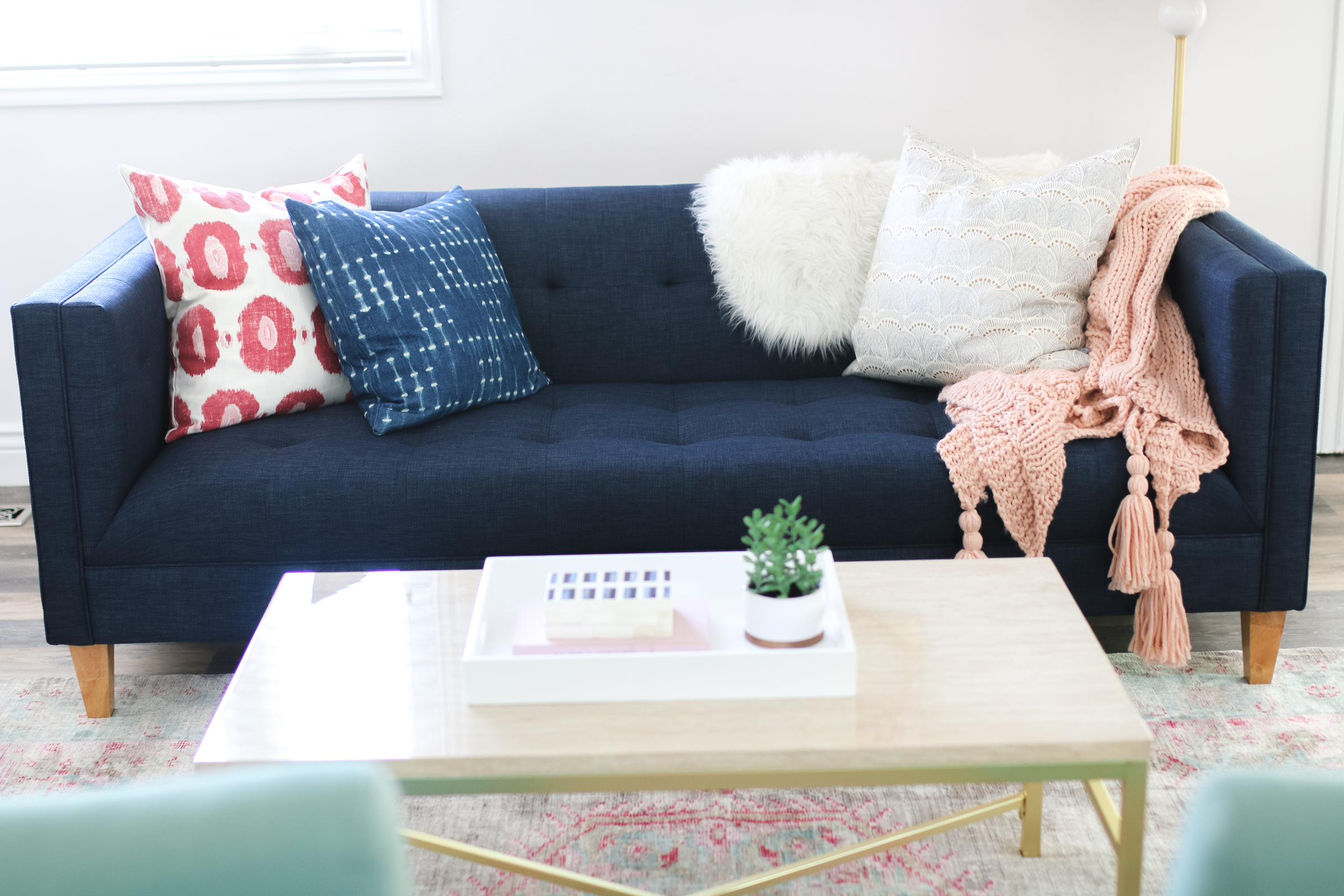 Our New Home Big Reveal: How We Styled Our Navy Couch by popular Utah blogger Sandy A La Mode