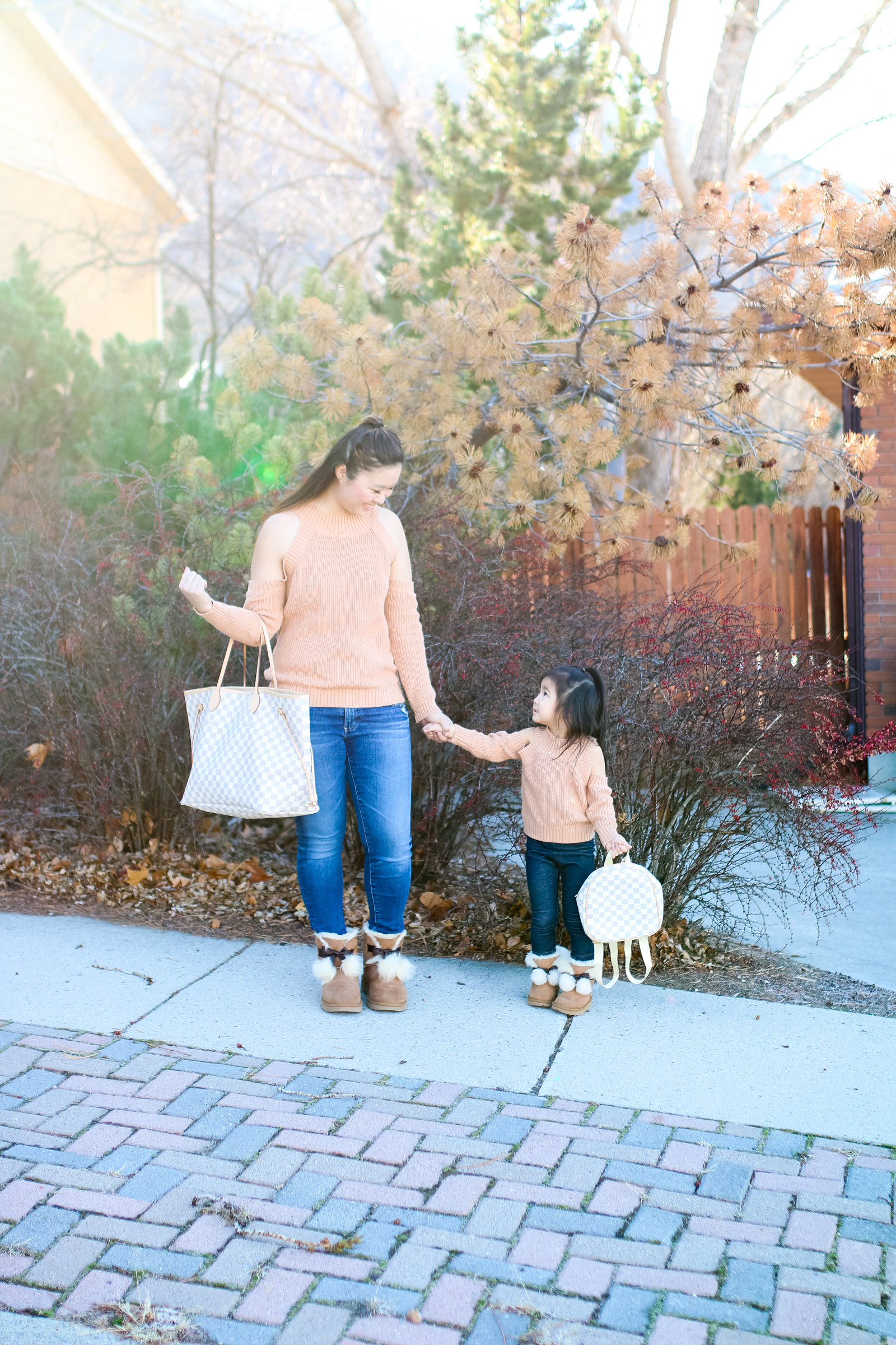Mommy and Me Outfit: Cold Shoulder Tops + Pom Pom UGGs by popular Utah style blogger Sandy A La Mode